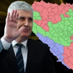 Dragan Čović pozdravlja rukom u pozadini karta BiH sa ucrtanim trećim entitetom.
