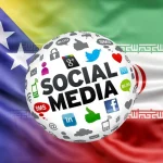 Stopljene zastave Bosne i Hercegovine i Irana ispred kojih je kugla sa ikonama društvenih mreža.