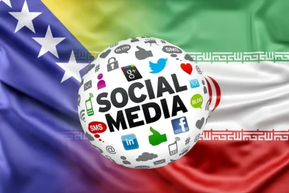 Stopljene zastave Bosne i Hercegovine i Irana ispred kojih je kugla sa ikonama društvenih mreža.