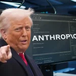 Predsjednik SAD upire prstom, iza na monitoru logo tvrtke Anthropic.